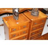 20th cent. Yew bedside 4 drawer chests - a pair.