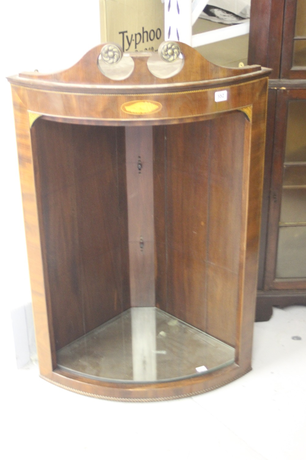 19th cent. Mahogany open fronted and wall mounted corner cupboard bow fronted with later additions.