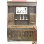 19th cent. Oak heavily carved dresser base & rack. Three central shelves flanked by 2 cupboards &