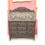 Far East: Pre-war 20th cent. heavily carved ebonised bureau the drop flap reveals a fitted