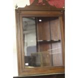 19th cent. Mahogany corner wall mounted cupboard with a single shaped shelf and glazed door.