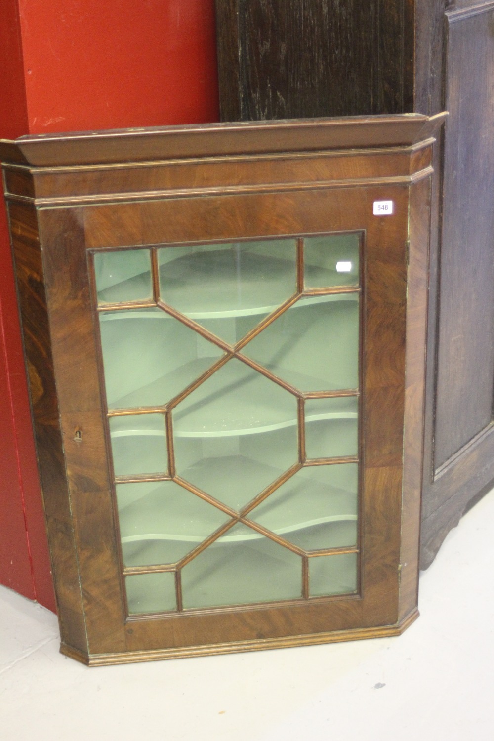 19th cent. Mahogany corner cupboard astral glazed door with shaped shelving.