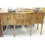 20th cent. Mahogany serpentine fronted sideboard flanked by 2 single doors and 2 central doors.