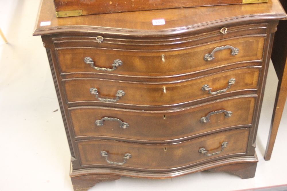 20th cent. Mahogany four drawer chest with brushing slide serpentine fronted on bracket supports.