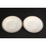 CUNARD WHITE STAR: A collection of Booth's soup bowls decorated with a gilt rim. (7) 9ins.