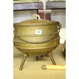 20th cent. Bronze cauldron and cover on tripod supports approx. 1 x gallon fill.