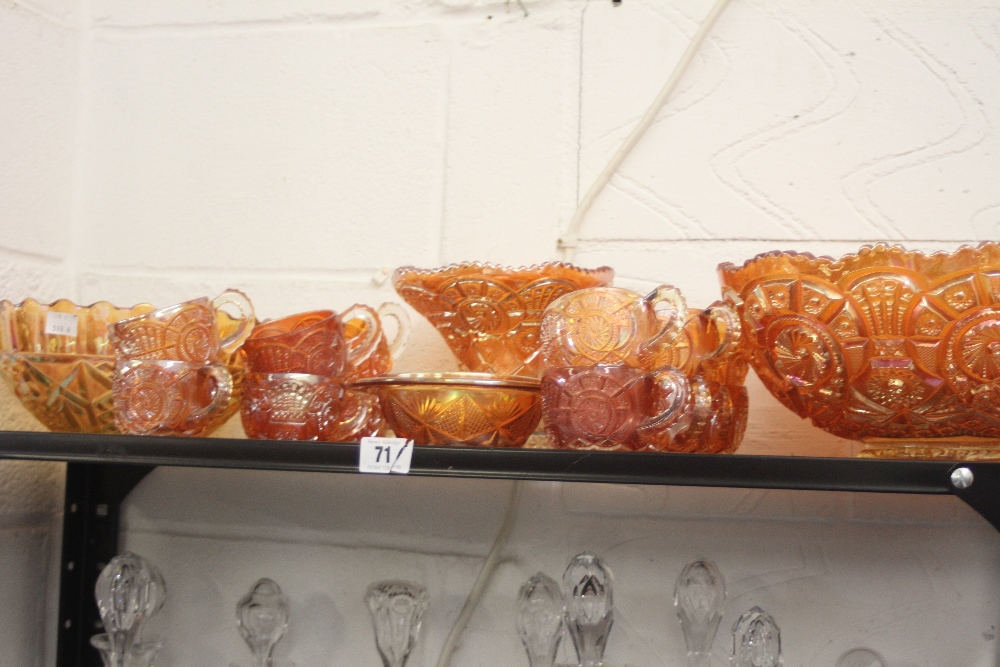 Late 19th early 20th cent. Carnival Glass: Orange punch bowl & 12 cups and two smaller bowls.
