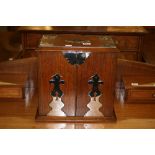 20th cent. Oak smokers companion with plated ware embellishments to the top & doors which open to