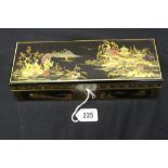 Oriental Lacquered glove box, heavily decorated with landscape and figures. 9" x 2" x 3".