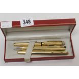 Pens: Sheaffer fountain pen, rolled gold, bright cut with 14k gold nib plus a Sheaffer gold plated