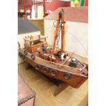 20th cent. Scratch built treen fishing boat with crew and catch.