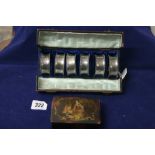 19th cent. Pewter: Six napkin rings in a leather covered cylinder box, silk lined 7ins. Plus a