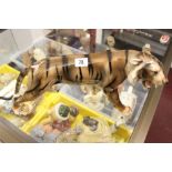 20th cent. Ceramic figure of a tiger, triangle mark beneath paw. 18½ins. long. 9ins. high.