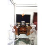 19th cent. Walnut & ebonised tantalus, Chapman patent No 197, with 3 decanters, 8 glasses & key.