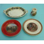 Two side plates, an oval stand with fruiting vine border and a small baluster jar with fruits and