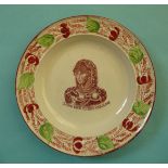 Queen Caroline: a pearlware nursery plate the moulded border decorated in iron red and green, the