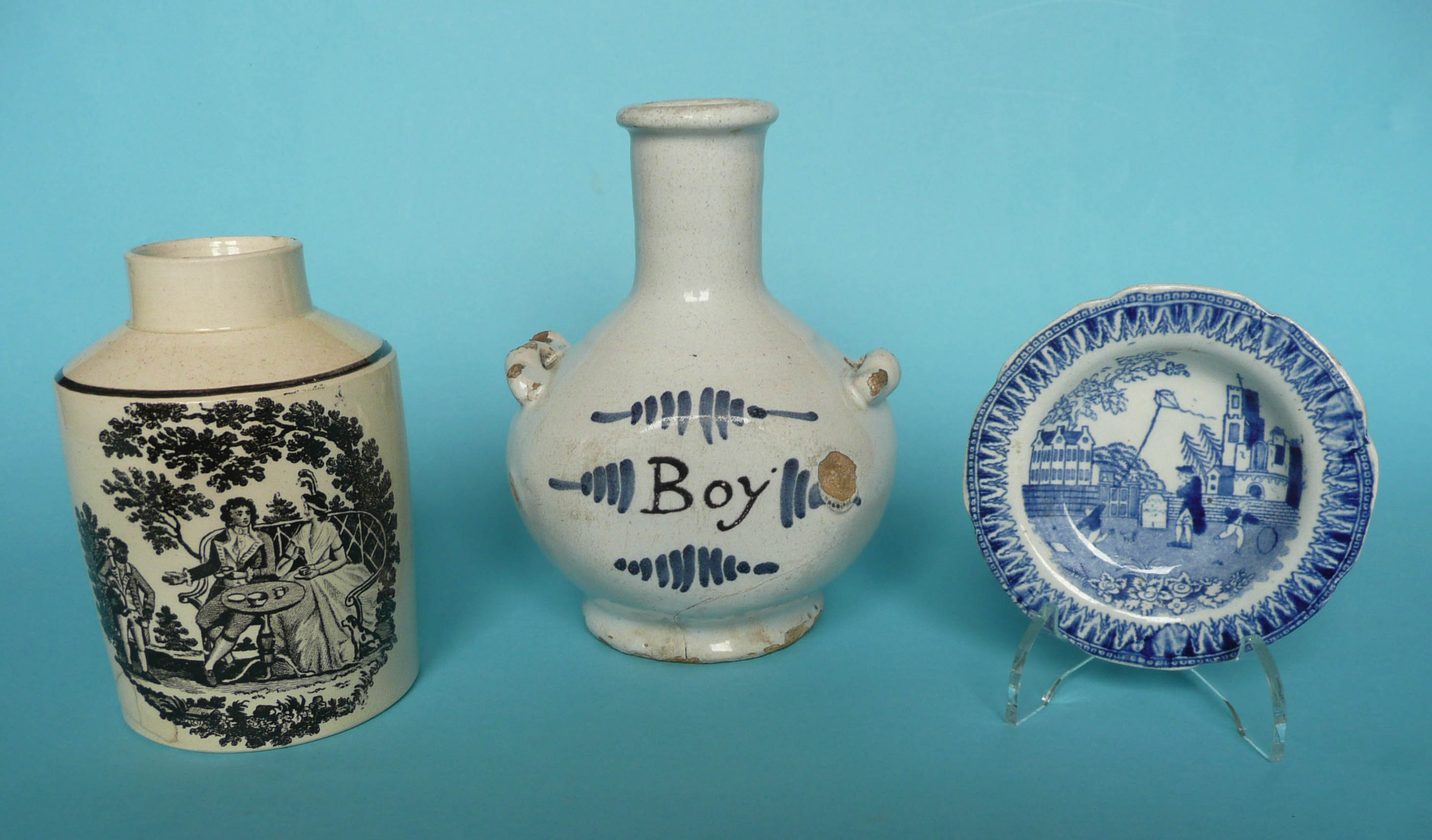 An 18th century Delft pottery bottle the shoulders set with twin handles, painted in blue and