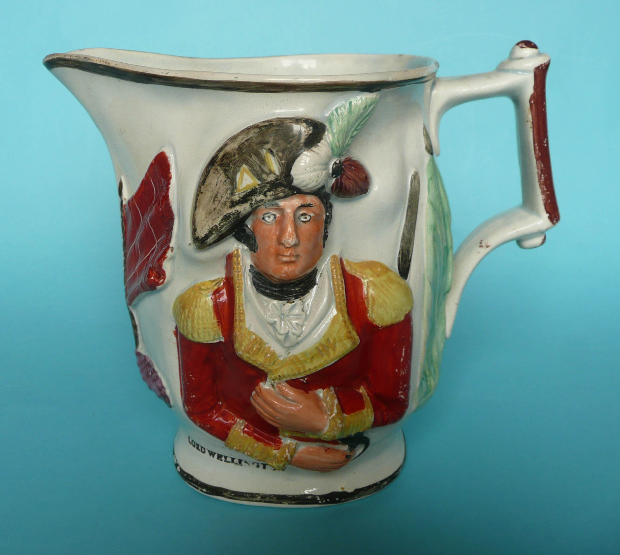 Lord Wellington and General Hill: a colourful moulded jug with named portraits, circa 1809, 160mm,