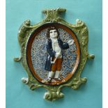 A Prattware plaque ‘The Parson’ moulded with integral elaborate scroll frame, depicted full-length