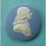 John Wesley: a Wedgwood blue jasperware circular medallion applied in white with a head and
