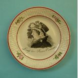 Queen Caroline: a pearlware nursery plate the basketware moulded border with floral vignettes, the