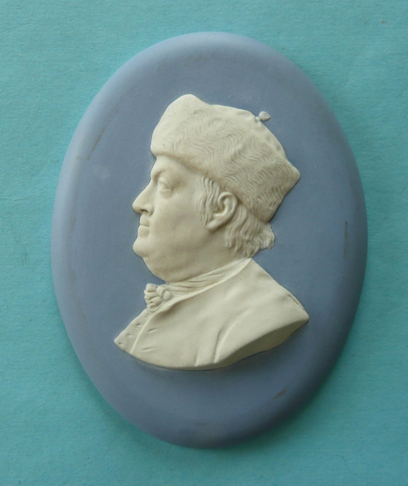 Benjamin Franklin: a Wedgwood blue jasperware oval medallion applied in white with a profile after