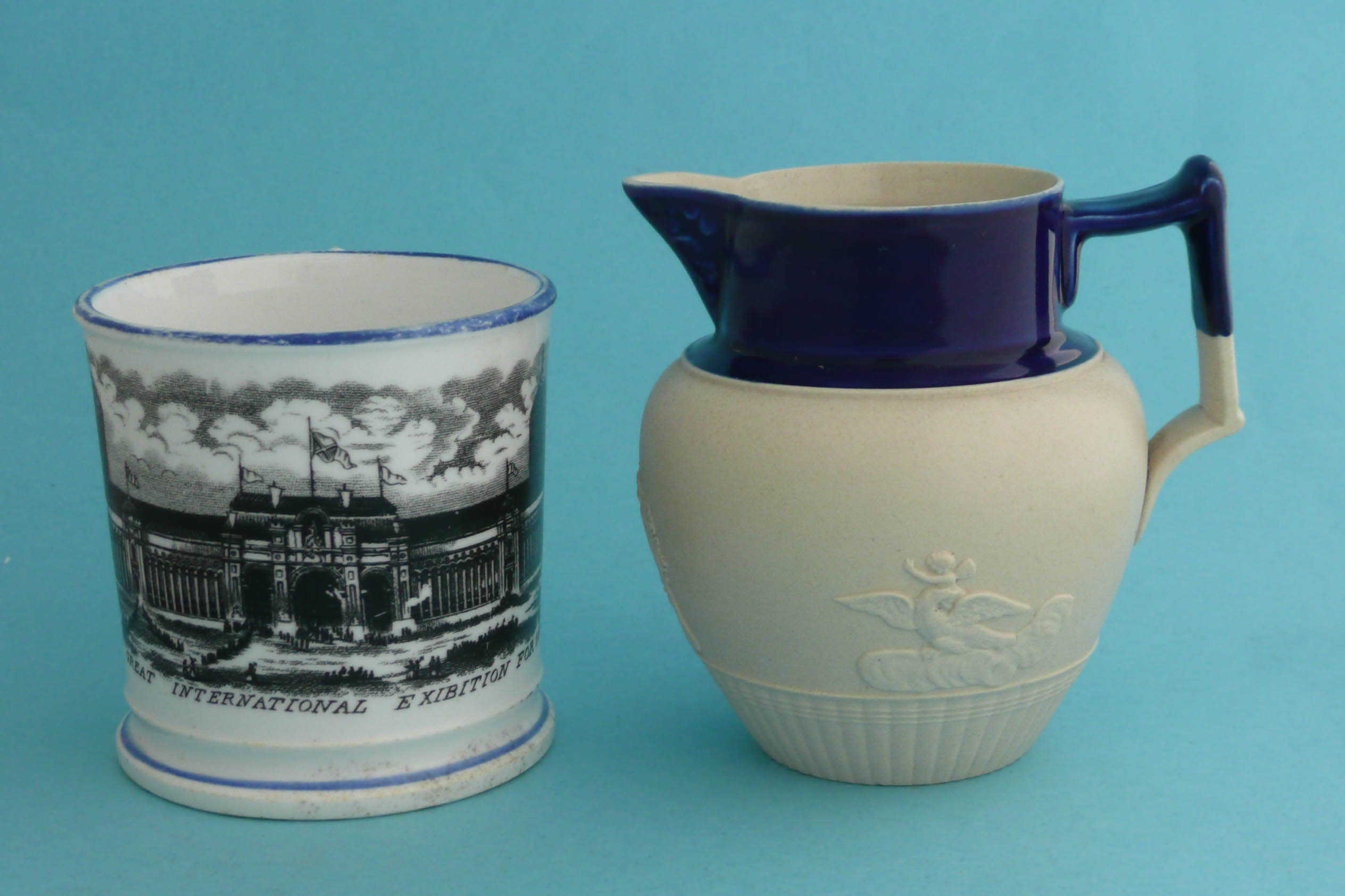 A mug printed in black with an inscribed view of 1862 International Exhibition and a small white