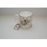 A 19TH CENTURY TANKARD DECORATED WITH ROSES AND OTHER FLOWERS,