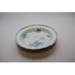 A WORCESTER BLUE AND WHITE PLATE WITH FRILLED EDGE,