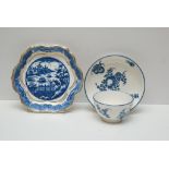 A CAUGHLEY BLUE AND WHITE TEA BOWL AND SAUCER DECORATED WITH FRUIT AND FLOWERS ALONG WITH A BLUE