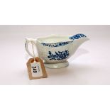 A BLUE AND WHITE SAUCE BOAT MOULDED WITH FLOWERS, THE CARTOUCHES WITH FLORAL DECORATION,