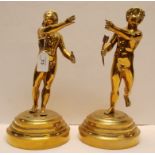 A PAIR OF HEAVY BRASS FIRE SIDE BOY AND GIRL FIGURES,