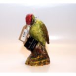 A ROYAL DOULTON MODEL OF A WOODPECKER,