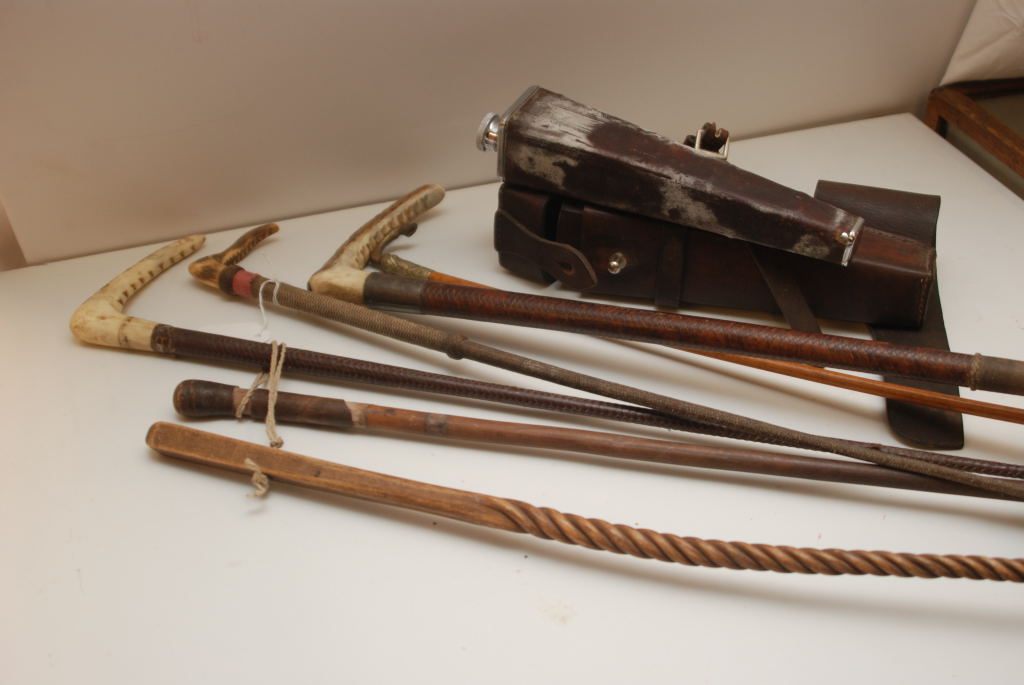 A SELECTION OF SIX RIDING CROPS ALONG WITH CASED HUNTING FLASK