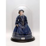 A STEINER BISQUE AUTOMATON DOLL UNDER GLASS DOME WITH WHEELS TO BASE,