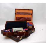 THREE CASES CONTAINING MASONIC REGALIA, APRONS, SASHES, BOOKS ETC.