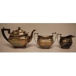 A SILVER THREE PIECE TEA SET,