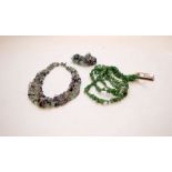 A JADE NECKLACE ALONG WITH A POLISHED GEM NECKLACE WITH MATCHING BRACELET.