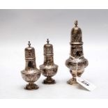 A SET OF THREE SILVER SIFTERS,