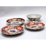 THREE IMARI PATTERN SHALLOW BOWLS AND A CHINESE BOWL DECORATED WITH FLOWERS