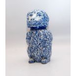 A 19TH CENTURY BLUE AND WHITE FAIENCE JAR AND COVER IN THE FORM OF A POODLE DOG