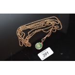 A CHAIN PROBABLY 9CT GOLD WITH ORIENTAL JADE PENDANT