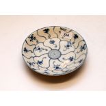 A TEK SING CARGO BLUE AND WHITE DISH, DIAMETER 18.