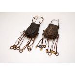 2 AFRICAN MEDICINE MAN BRONZE SPOREN TYPE POCKETS WITH LEATHER TASSELS AND SHELLS