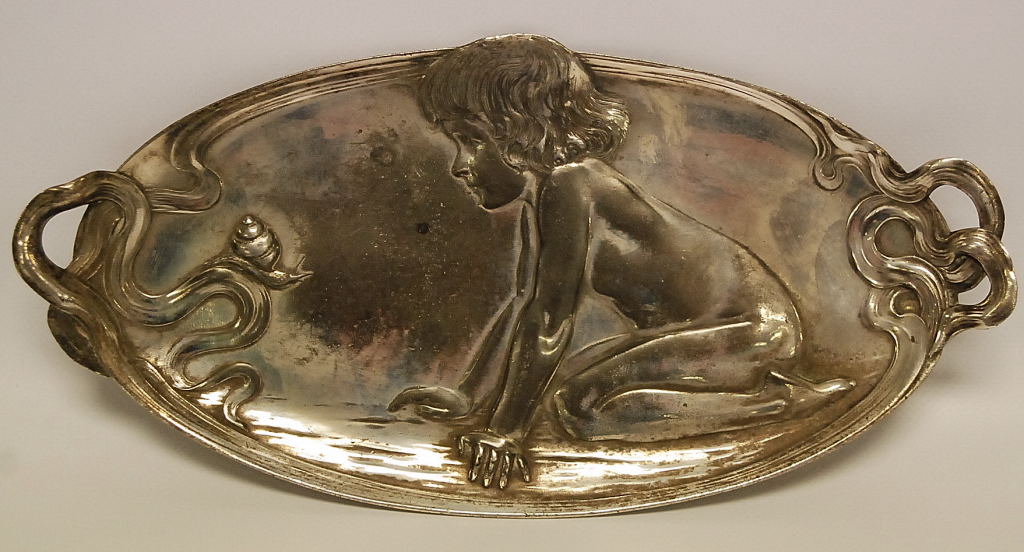 AN ART NOUVEAU WMF ELECTRO PLATED TRAY DESIGNED WITH A CHILD LOOKING AT A SNAIL