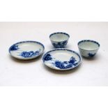 A PAIR OF NANKING CARGO BLUE AND WHITE TEA BOWLS AND SAUCERS