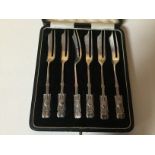 A CASED SET OF SIX ART NOUVEAU SILVER CAKE FORKS BY LIBERTY AND CO.