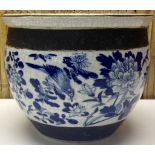 A CHINESE BLUE AND WHITE GLAZED JARDINIERE DECORATED WITH BIRDS AND FLOWERS BETWEEN TWO COPPER