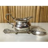 A SMALL SILVER CIRCULAR CREAM BOAT, WITH DOUBLE SCROLLED HANDLE AND PAW FEET, BIRMINGHAM ASSAY,