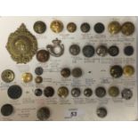 COLLECTION OF BUTTONS AND BADGES MOUNTED ON CARD,